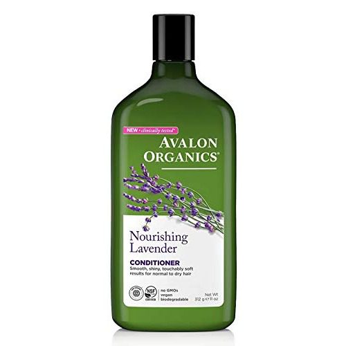 Front of zip tote bag with white canvas, black canvas straps and handle, and black zipper pulls.